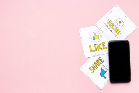 Digital marketing concept with mobile phone and social media icons.
