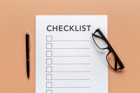 Checklist concept. Blank checklist with empty boxes on office table.の写真素材