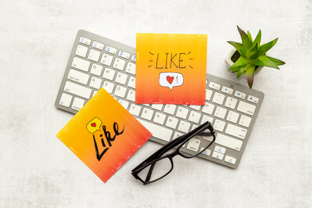 Blogger influencer concept with social media icons. Working table top view.