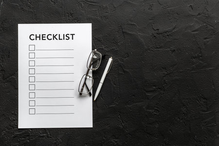 Checklist concept. Blank checklist with empty boxes on office table.の写真素材