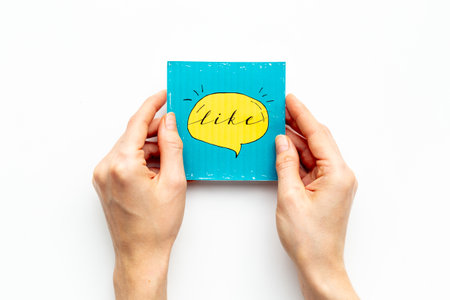 Hands holding Like icon for social media. Digital marketing concept.