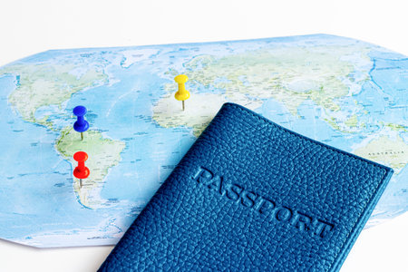 Passport on world map, vacation trip concept. Planning travel.の写真素材