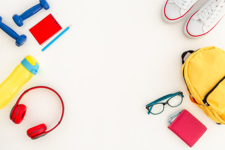 Student school yellow backpack with supplies, top view. Flatlay.の写真素材