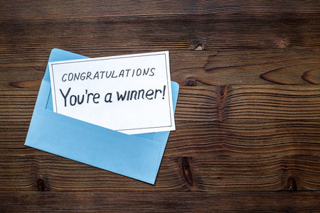 Congratulatory letter for the winner on letter envelope. Winner concept