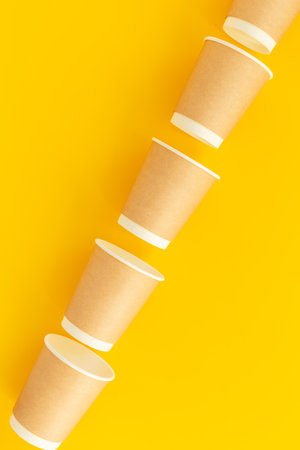Stack of recyclable coffee paper cups, top view. Eco-friendly zero waste products.の写真素材