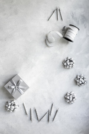 Celebration carnival party with gift box and cake candles, top view.の写真素材