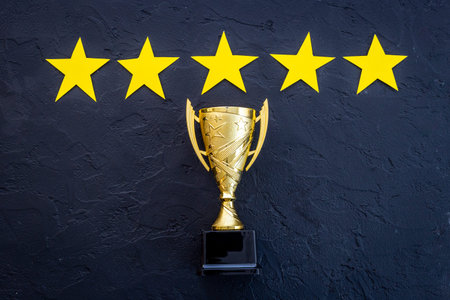 Award golden trophy cup with five stars. Best of the best concept.