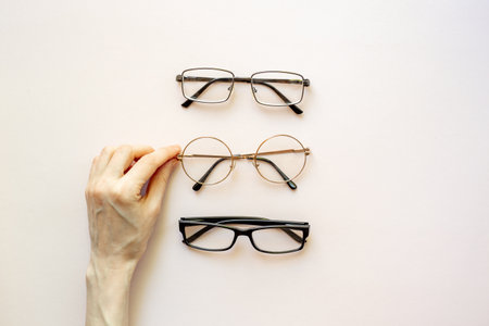 Eyeglasses top view. Comparing lenses in optics store.の写真素材
