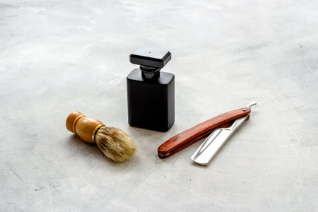Perfume for men and shaving tools. Male accessories close up