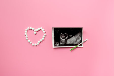 Ovulation and pregnancy tests with Ultrasound image of the baby and medicines. Treatment of female infertility.の写真素材