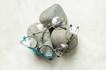 Eye glasses with different lenses, top view. Eyes healthcare concept.の写真素材