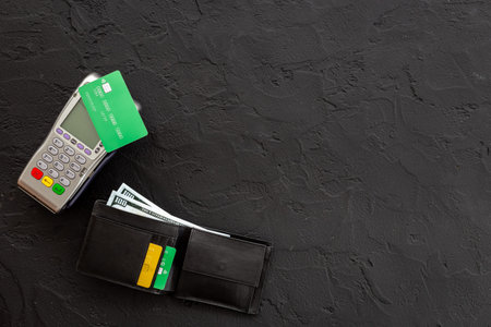 Pos bank terminal for payment by credit card with wallet and cash. Concept of choosing payment...