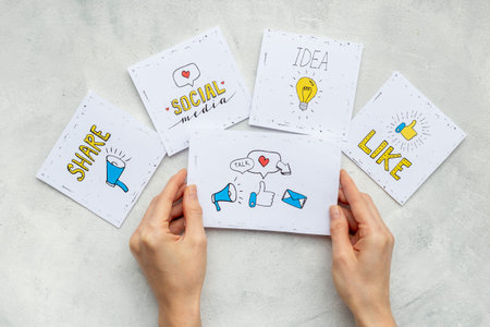Hands holding Like icon for social media. Digital marketing concept.
