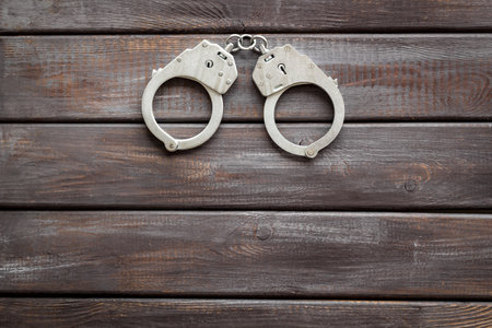 Police metal handcuffs top view. Criminal offense and detention conceptの写真素材