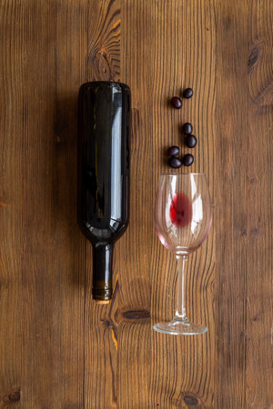 Bottle of wine with wineglass and grapes. Wine backgroundの写真素材