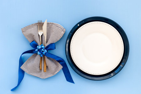 Festive Christmas table setting with blue colored decoration. Top view.の写真素材