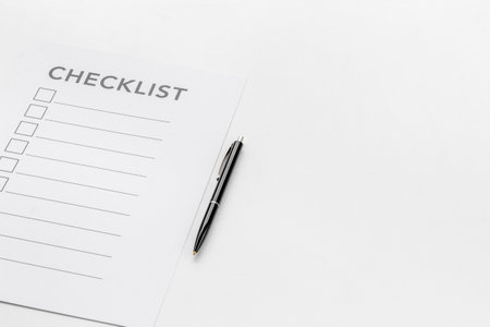 Checklist concept. Blank checklist with empty boxes on office table.