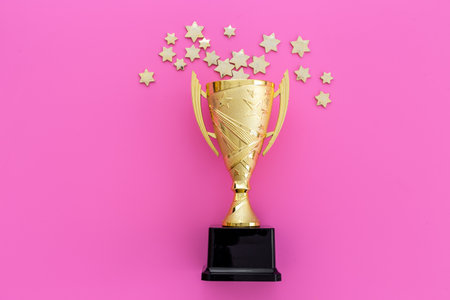 Award golden trophy cup as a symbol of victory. Winning the competition concept.の写真素材