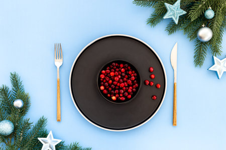 Festive Christmas table setting with blue colored decoration. Top view.