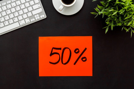 Sales concept. Online shopping - table with computer and discount sing, top view.の写真素材