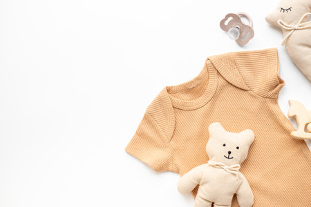 Flat lay with eco friendly baby cloth and accessories. Sustainable lifestyle, zero waste background.の写真素材