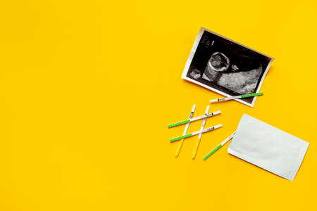 Ovulation and pregnancy tests with Ultrasound image of a baby. Pregnancy and conceiving a child conceptの写真素材