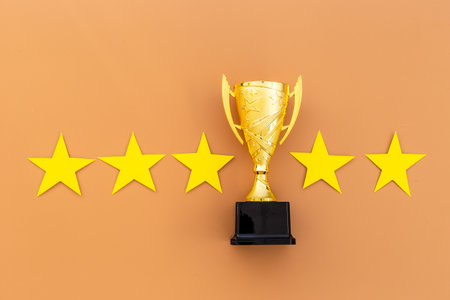 Award golden trophy cup with five stars. Best of the best concept.