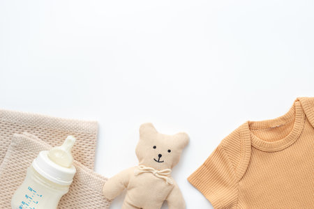 Flat lay with eco friendly baby cloth and accessories. Sustainable lifestyle, zero waste background.の写真素材