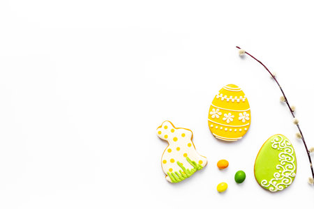 Easter homemade cookies and eggs with willow branches, top view.の写真素材