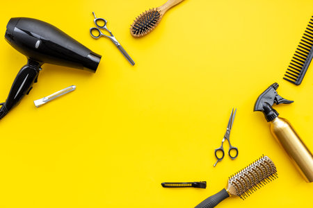 Set of combs, scissors and hair dryer, hairdresser tools set, top view.の写真素材