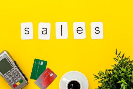Sales sing with POS payment terminal and credit cards, top view. Online shopping concept.の写真素材