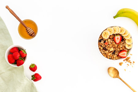 Breakfast with cereal granola honey and strawberry, top view.の写真素材