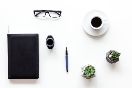 Inkwell and book - writer or blogger working space desktop, top view.の写真素材