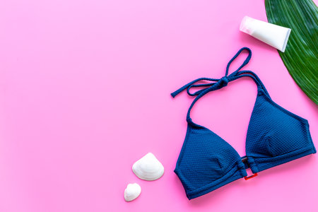 Beach accessories or summer outfit with palm leaves flat lay, top view.の写真素材