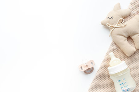 Flat lay with eco friendly baby accessories and bottle with milk. Zero waste background.の写真素材