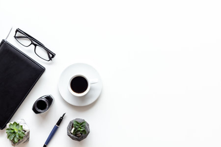 Writer or blogger workspace with notepad and ink, top view.の写真素材