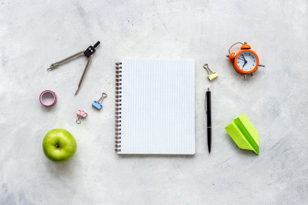 Blank sheet of notebook with school supplies, top view. Education concept.の写真素材