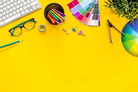 Decorator workspace flat lay. Creative designers table with color paint swatches.の写真素材