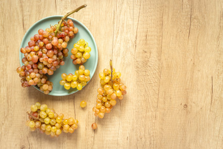Many fresh green grape clusters isolated, top view.の写真素材