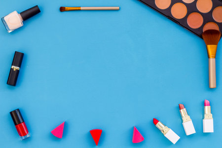 Frame of various makeup tools and cosmetics products, top view.の写真素材