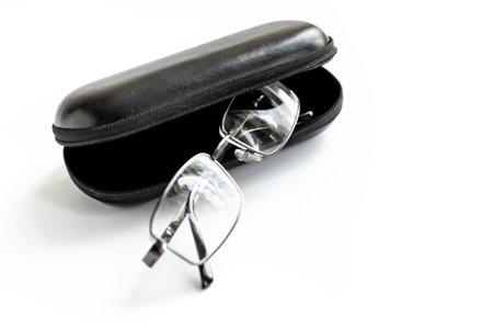 Stylish eyeglasses with glasses case on white. Eye care and protection concept.の写真素材
