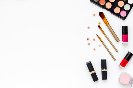 Various makeup cosmetic products - blusher, mascara, lipstick, nail polish and brushes, top view.の写真素材