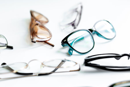 Stylish eyeglasses with lenses on white. Eye care and protection conceptの写真素材