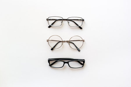 Many different stylish glasses in various styles and colors, top view.の写真素材