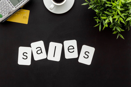 Sales sing with POS payment terminal and credit cards, top view. Online shopping conceptの写真素材