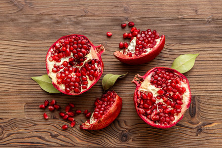 Fresh ripe pomegranate with half and pieces ready for eating. Top viewの写真素材
