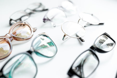Many different styles of eyeglasses with lenses on white. Eye care and protection concept.の写真素材