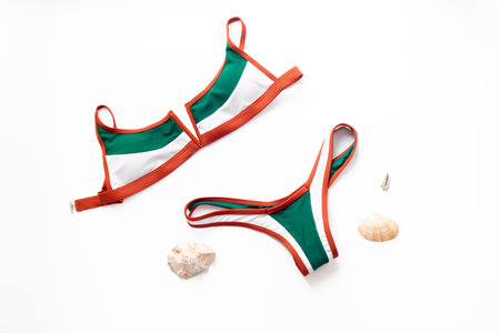 Female summer bikini swimsuit flat lay, top view. Tropical beach concept.の写真素材