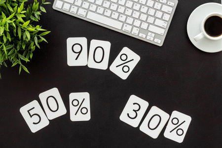 Sales concept. Online shopping - table with computer and discount sing, top view.の写真素材