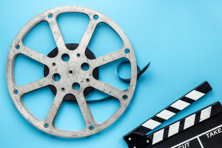 Old 35mm motion picture film reel directors clapperboard.の写真素材